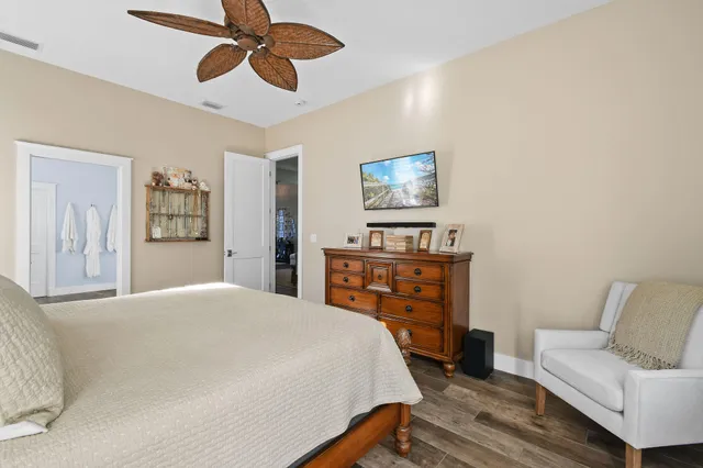 a bedroom with a bed and a dresser