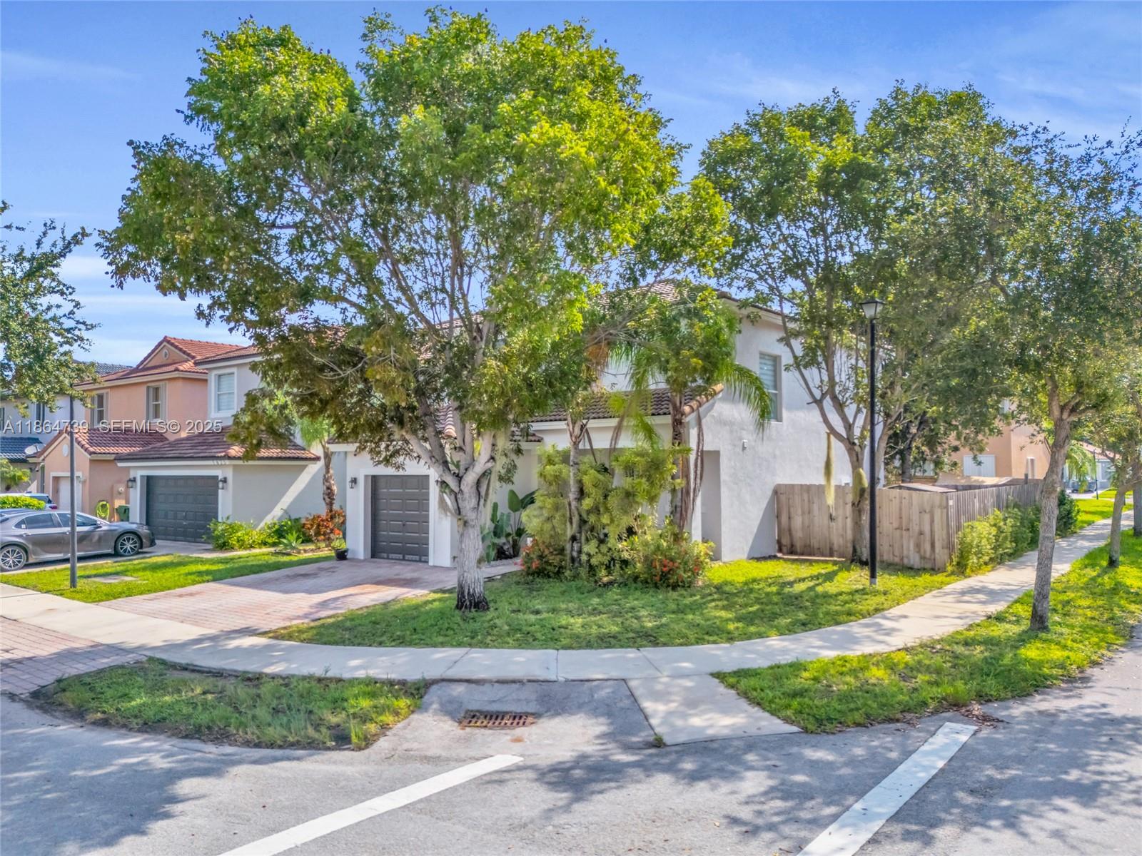 1635 Southeast 20th Terrace Homestead, FL 33035 - Photo 13 of 52 a view of street with houses in the background