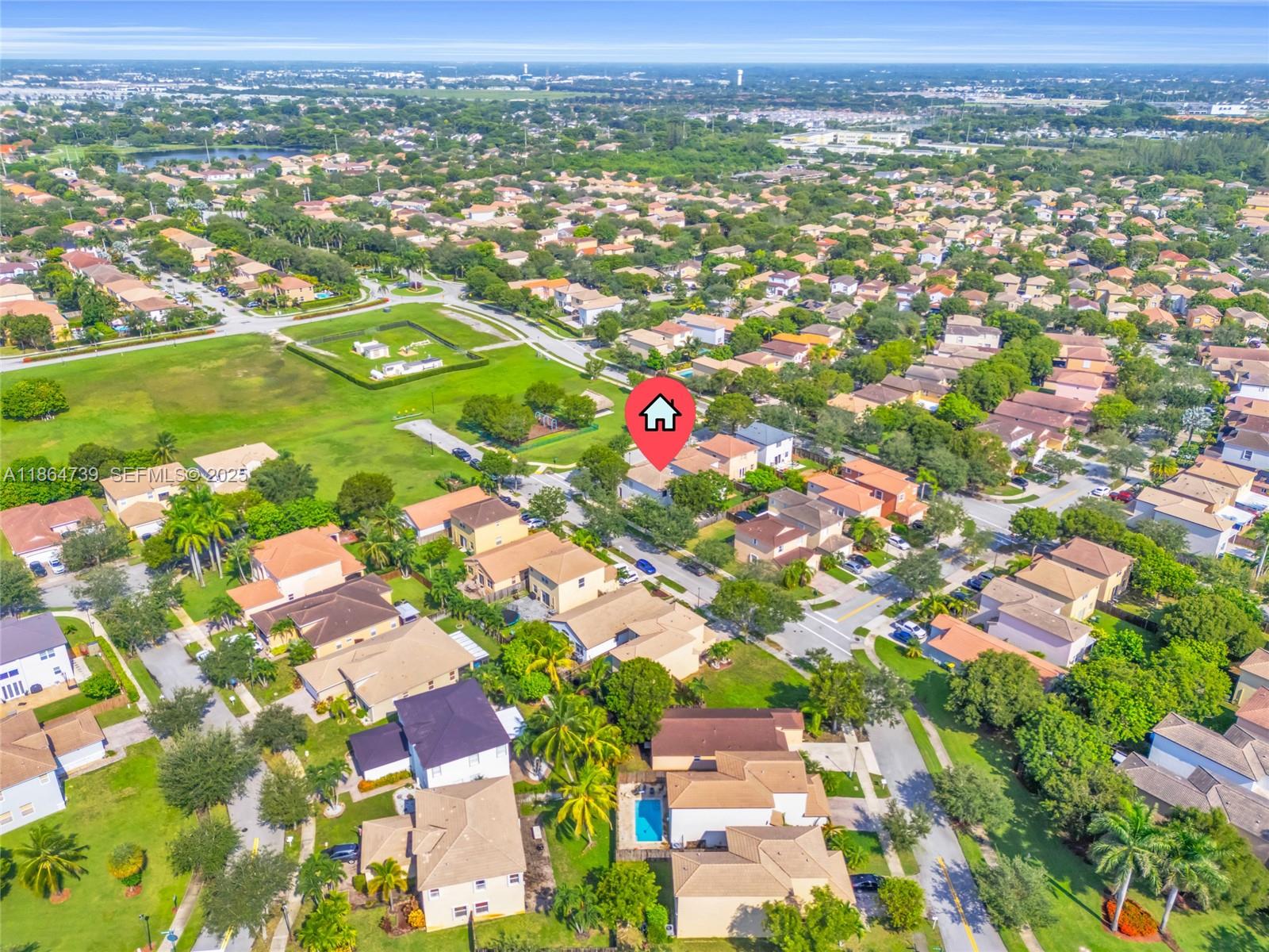 1635 Southeast 20th Terrace Homestead, FL 33035 - Photo 17 of 52 an aerial view of residential houses with outdoor space and trees