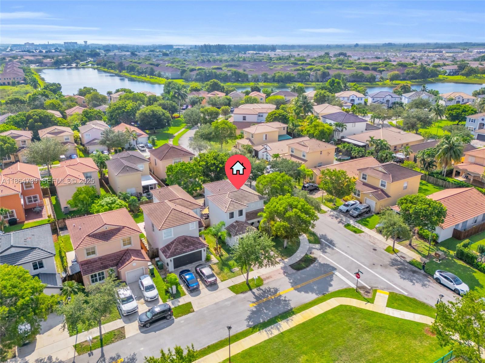 1635 Southeast 20th Terrace Homestead, FL 33035 - Photo 18 of 52 an aerial view of residential houses with outdoor space and parking