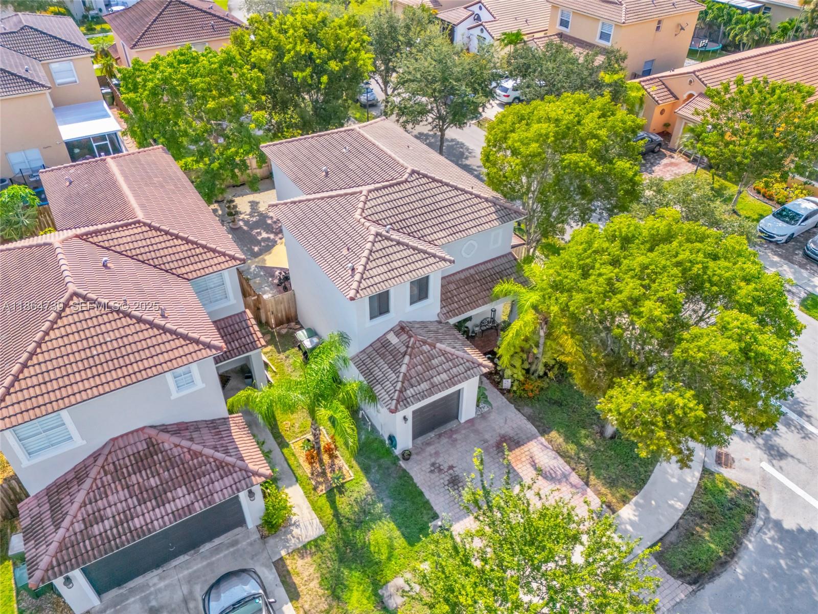 1635 Southeast 20th Terrace Homestead, FL 33035 - Photo 19 of 52 a aerial view of a house with large garden and plants
