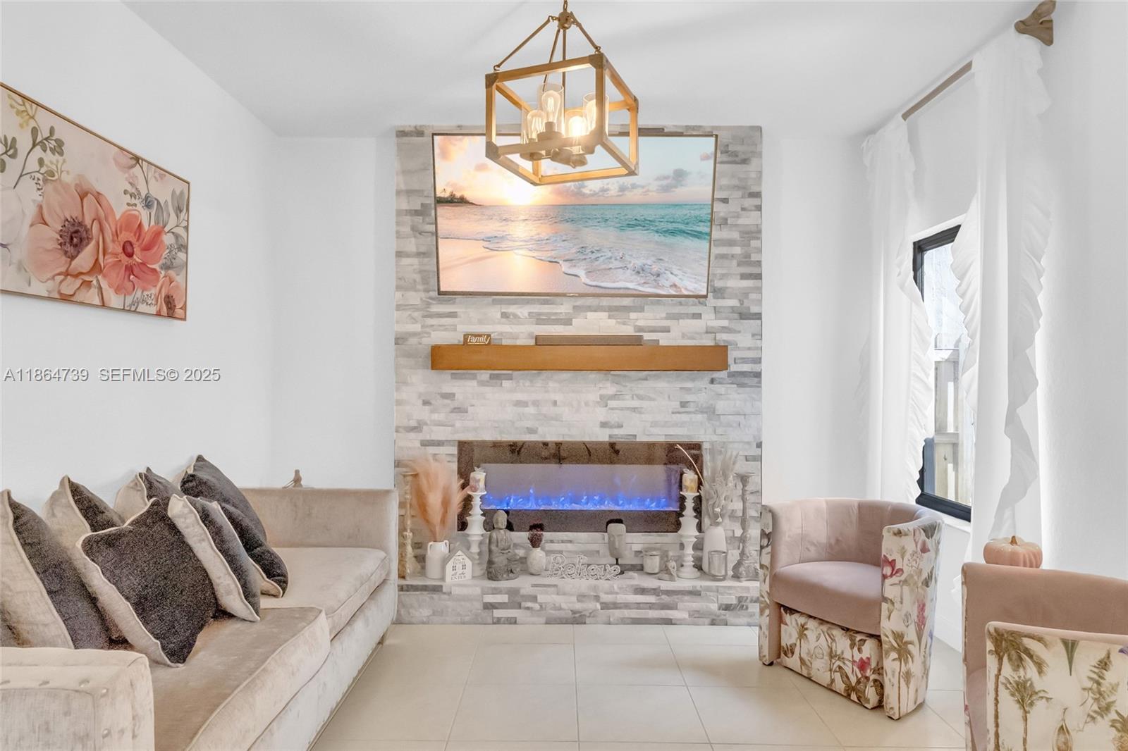 1635 Southeast 20th Terrace Homestead, FL 33035 - Photo 21 of 52 a living room with furniture and a fireplace