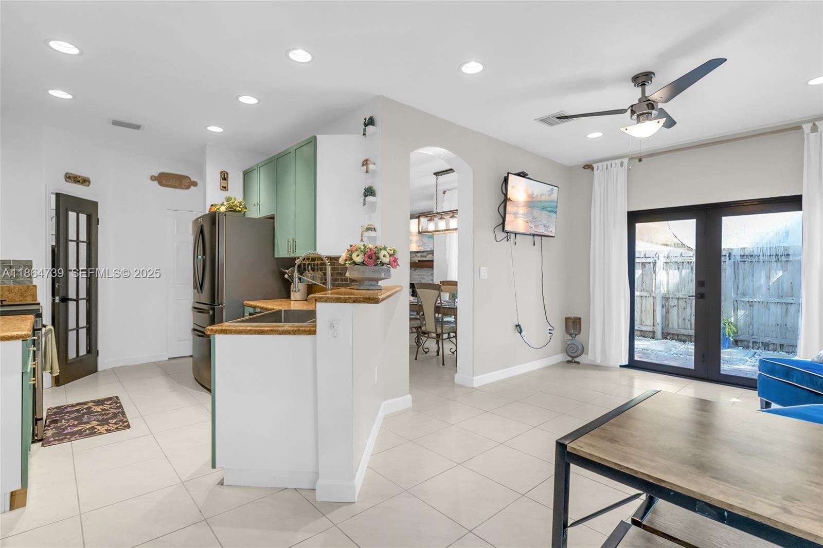 1635 Southeast 20th Terrace Homestead, FL 33035 - Photo 27 of 52 a living room with furniture and a open kitchen view
