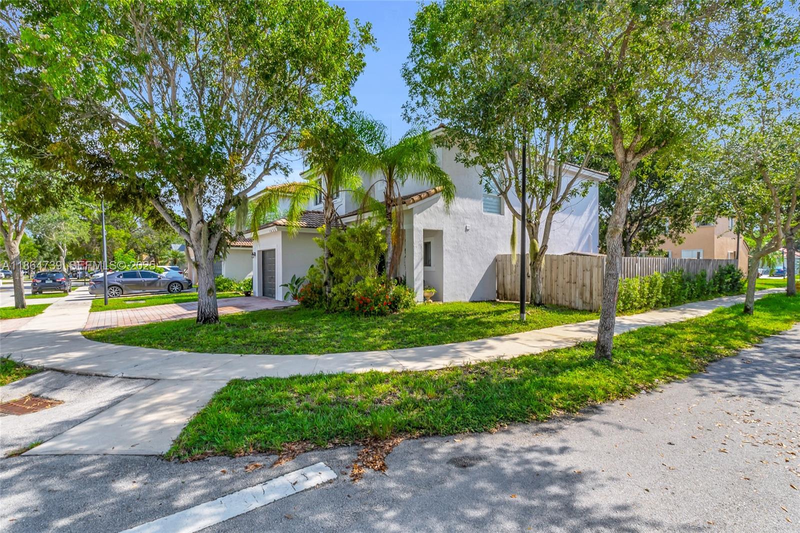 1635 Southeast 20th Terrace Homestead, FL 33035 - Photo 3 of 52 a front view of a house with a yard