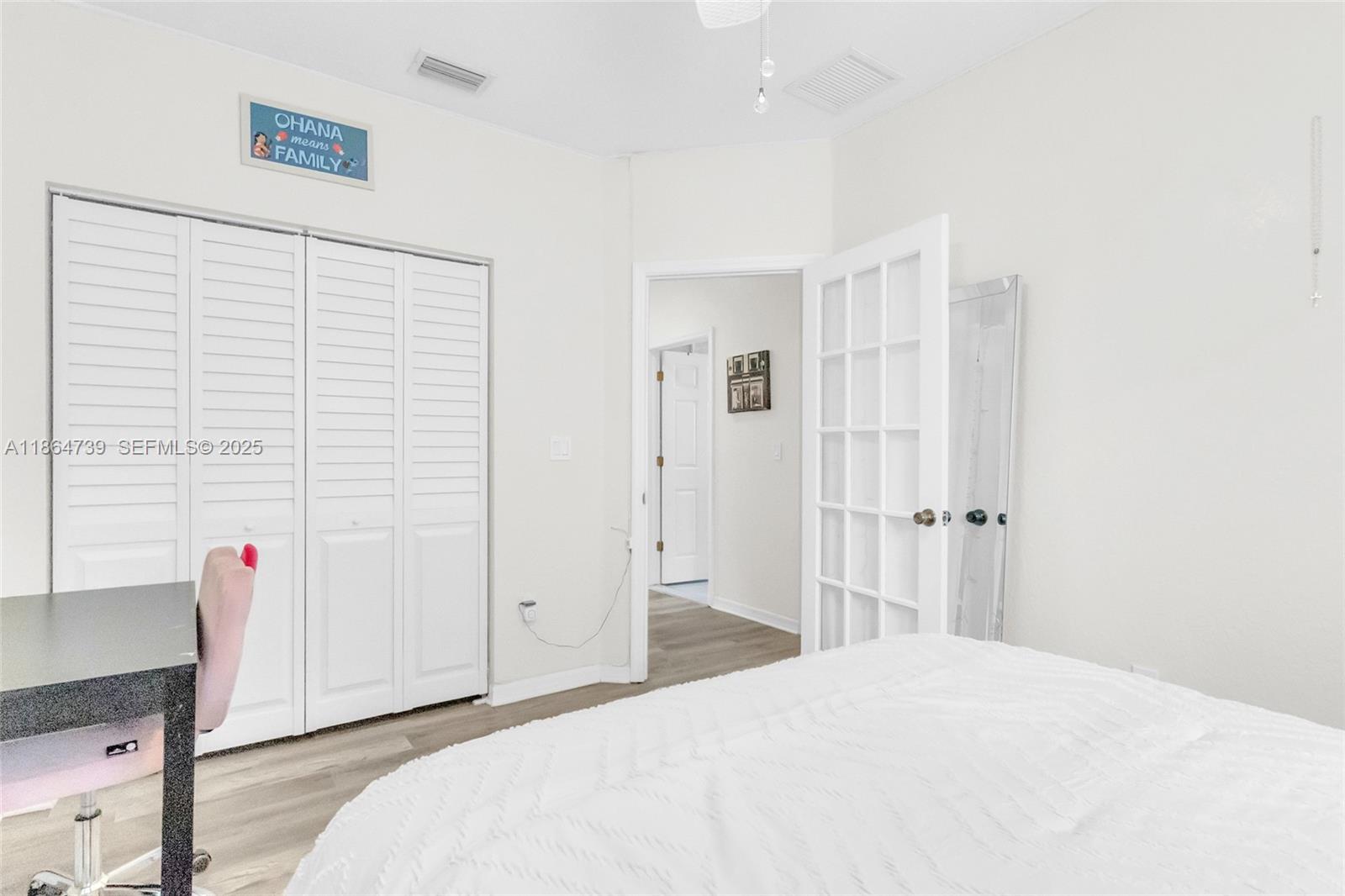 1635 Southeast 20th Terrace Homestead, FL 33035 - Photo 38 of 52 a bedroom with a bed and a closet