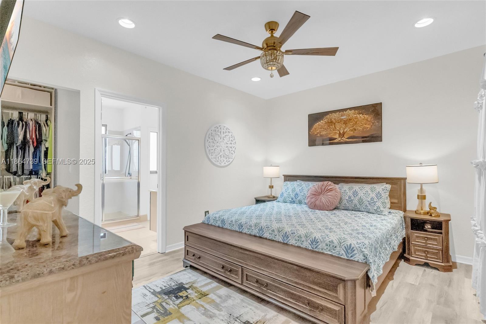 1635 Southeast 20th Terrace Homestead, FL 33035 - Photo 41 of 52 a bedroom with a bed and wooden floor