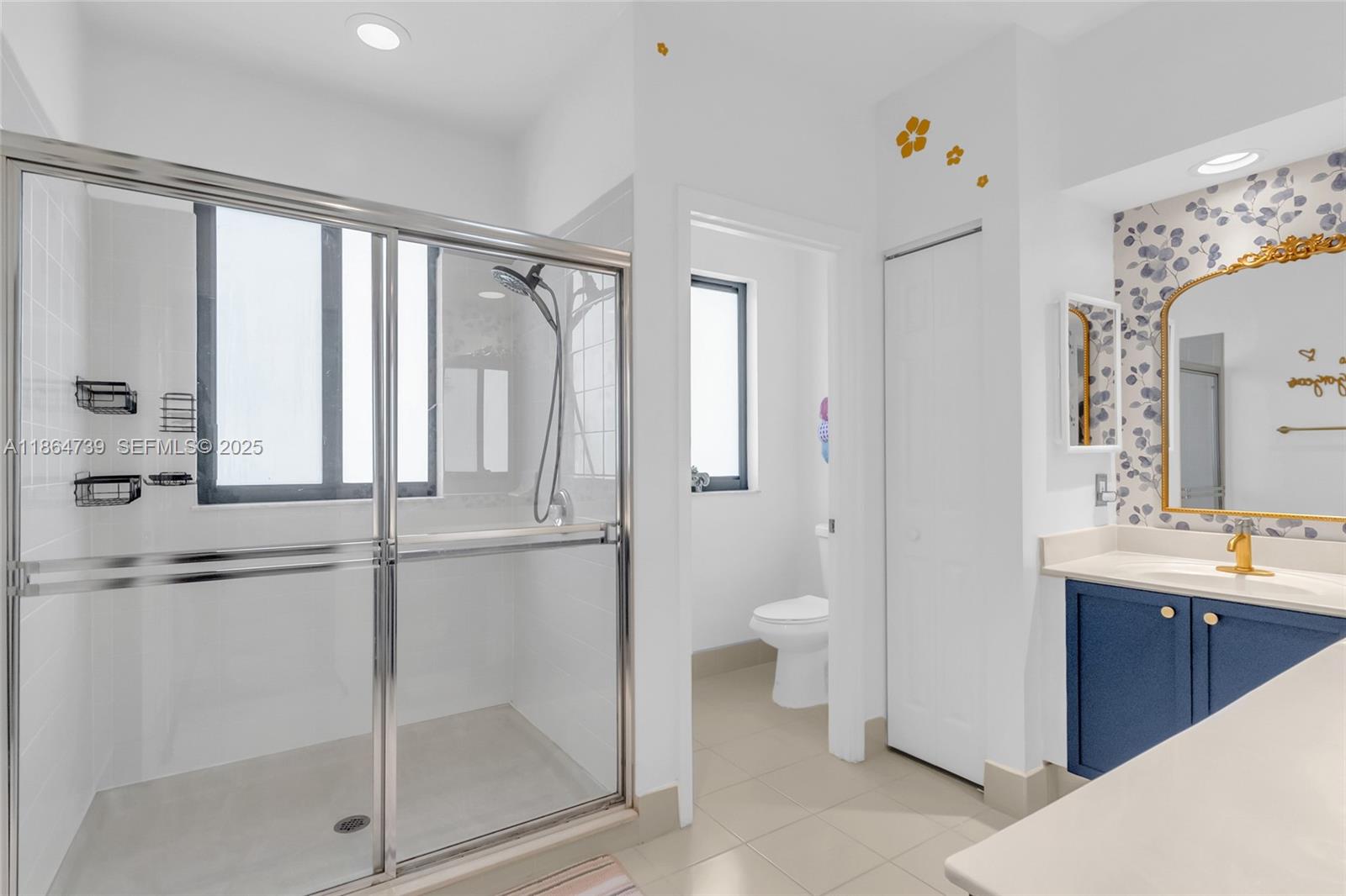 1635 Southeast 20th Terrace Homestead, FL 33035 - Photo 43 of 52 a bathroom with a granite countertop sink mirror and toilet