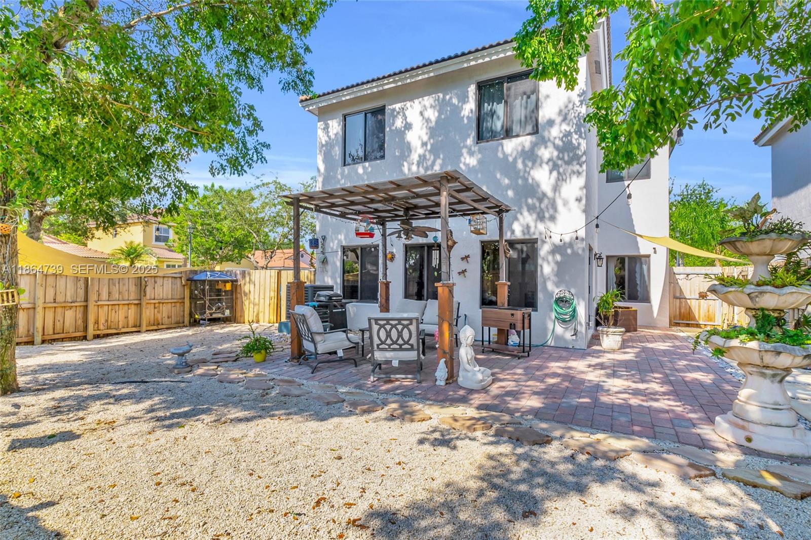 1635 Southeast 20th Terrace Homestead, FL 33035 - Photo 47 of 52 a view of a house with backyard porch and sitting area