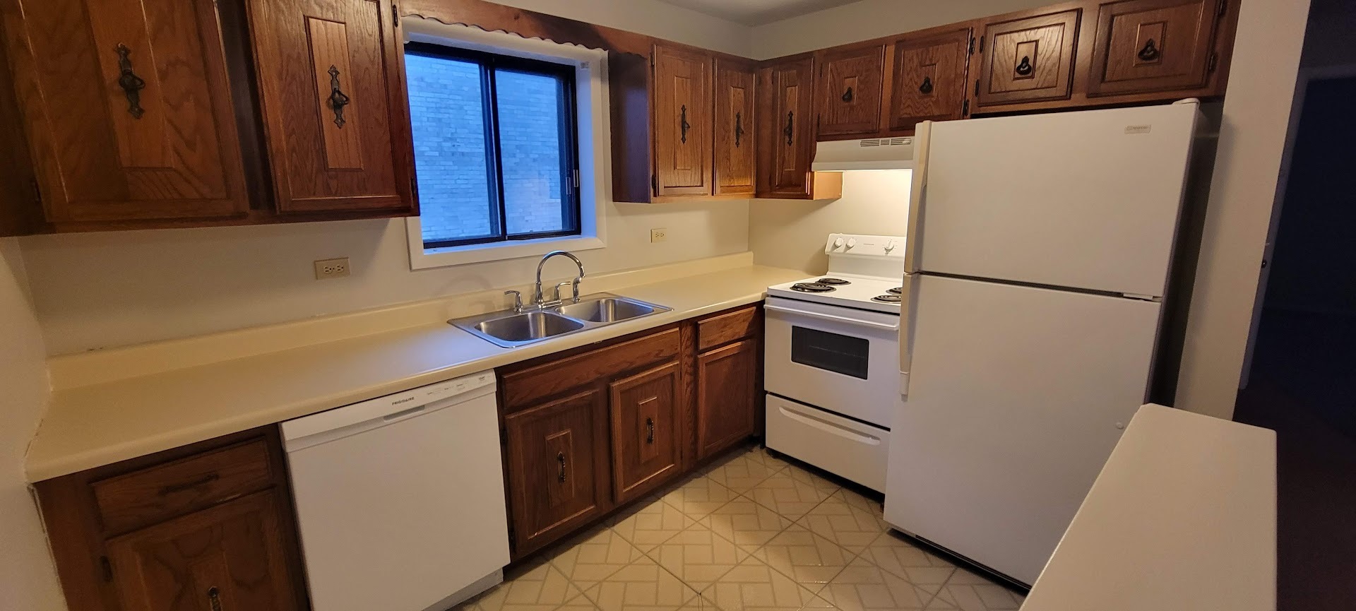1832 Goodwin Drive, Unit 3A Palatine, IL 60074 - Photo 4 of 9 a white refrigerator freezer sitting inside of a kitchen