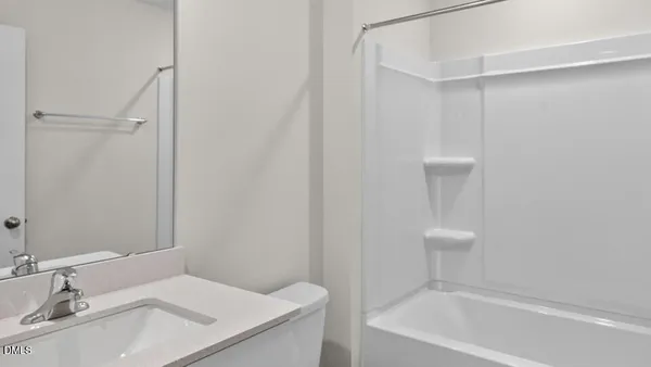a bathroom with a sink a toilet and a bathtub