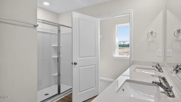 a bathroom with a sink and shower