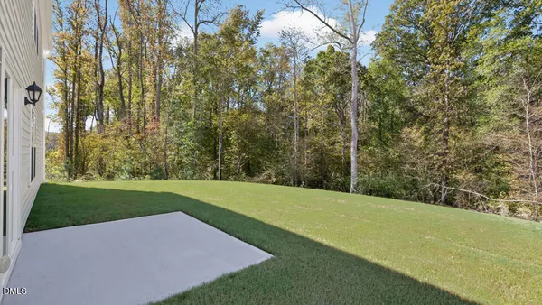 a view of a backyard of the house