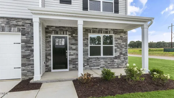 a view of a brick house with a large windows