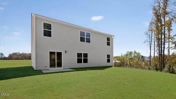 a view of house with yard