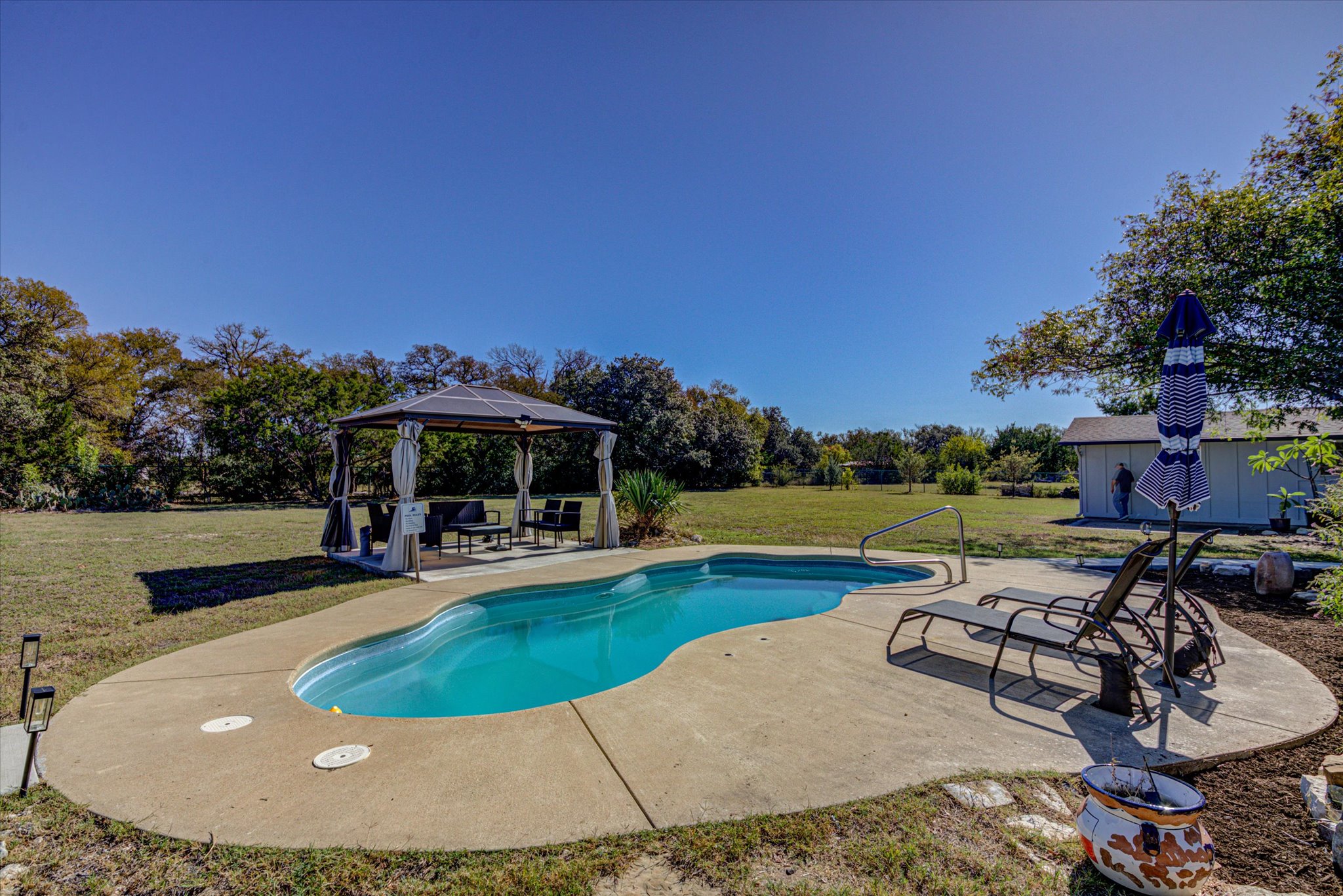 200 Harbor Circle Georgetown, TX 78633 - Photo 24 of 38 a view of a swimming pool with lounge chairs