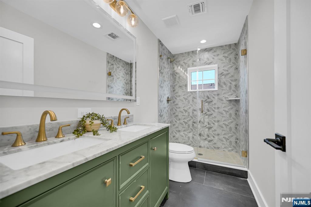 46 Snyder Avenue Berkeley Heights, NJ 07922 - Photo 22 of 38 a bathroom with a double vanity sink toilet and shower