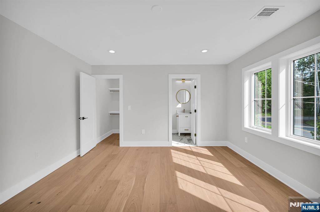 46 Snyder Avenue Berkeley Heights, NJ 07922 - Photo 23 of 38 wooden floor in an empty room with a window