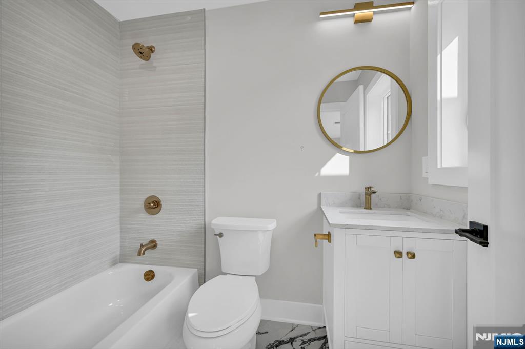 46 Snyder Avenue Berkeley Heights, NJ 07922 - Photo 24 of 38 a bathroom with a sink a toilet and a mirror