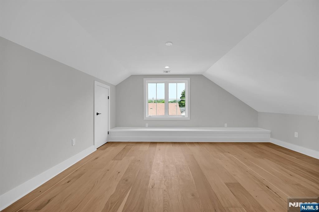 46 Snyder Avenue Berkeley Heights, NJ 07922 - Photo 29 of 38 an empty room with wooden floor and windows