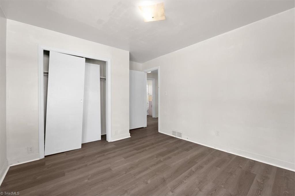 1130 Tabor Street High Point, NC 27262 - Photo 13 of 19 Second bedroom also has large double-door closet.