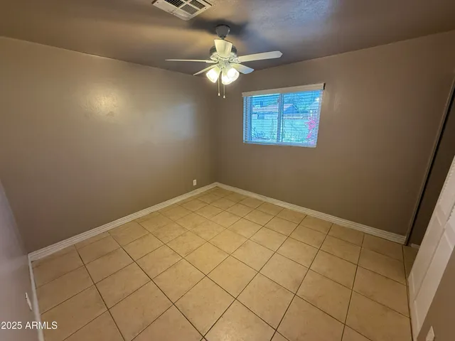 a view of room with wooden floor