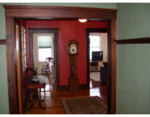 20 Parkton Road, Unit 3 20 Boston, MA 02130 - Photo 2 of 6 a hallway with table and a mirror