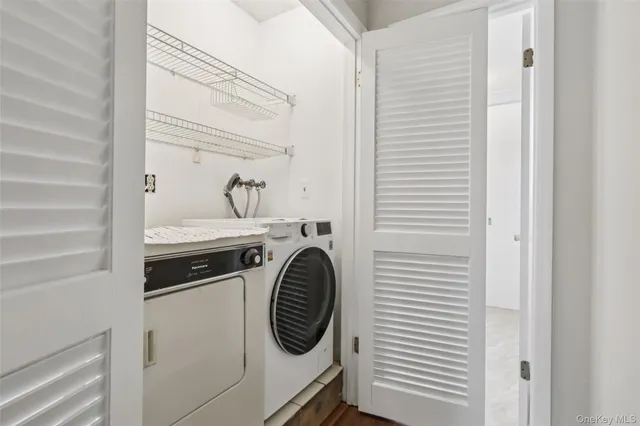 a utility room with dryer and washer