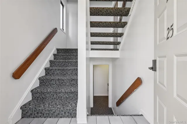 a view of entryway with stairs