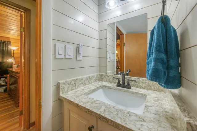 a bathroom with a shower curtain and a toilet