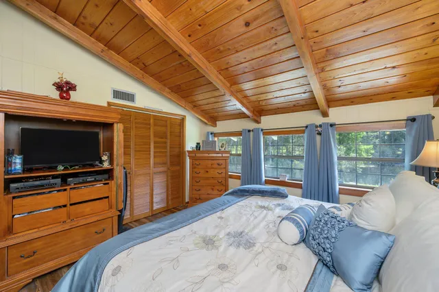 a view of a house with swimming pool and a yard