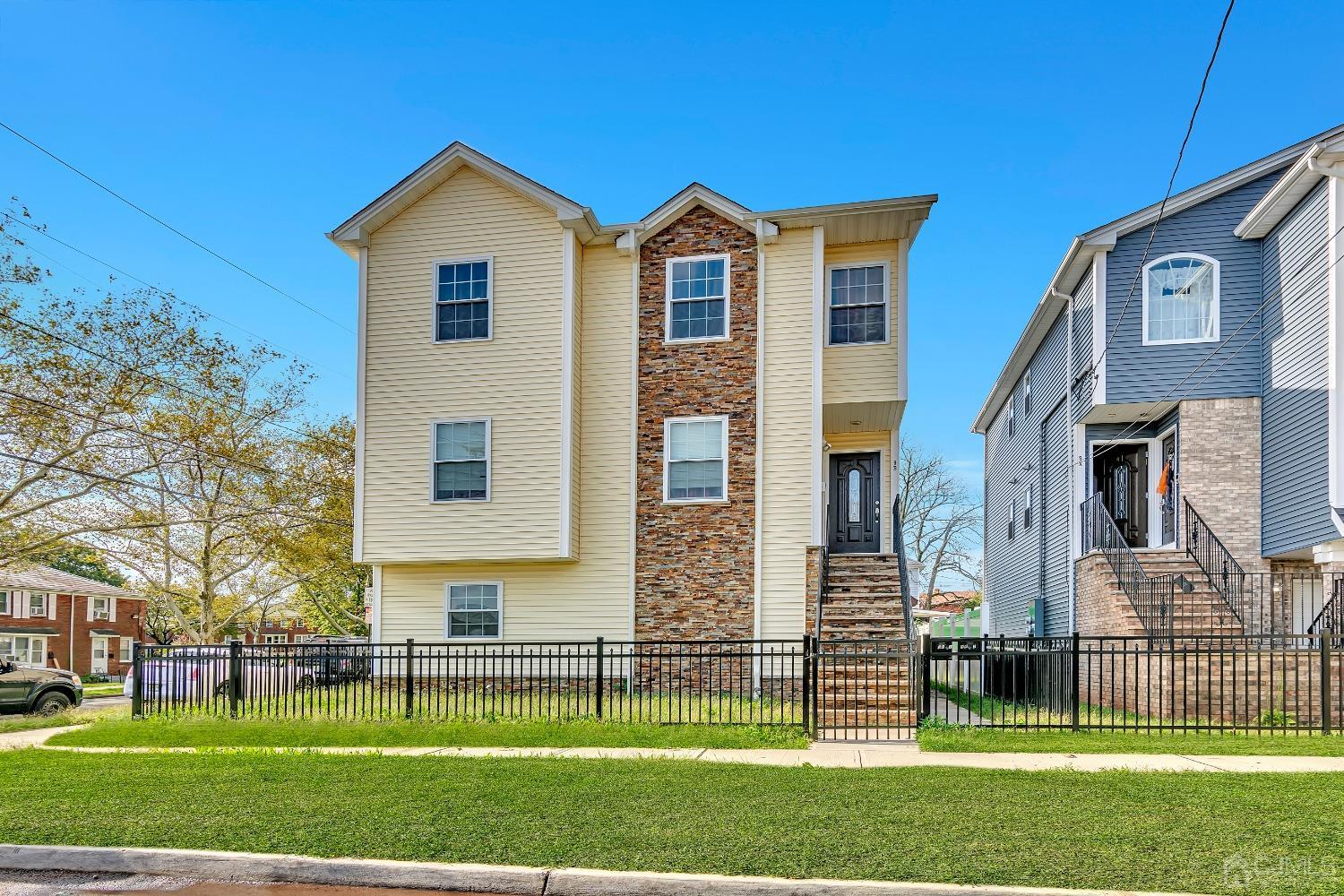 B Wright Place New Brunswick, NJ 08901 - Photo 1 of 34 a front view of a house with a yard