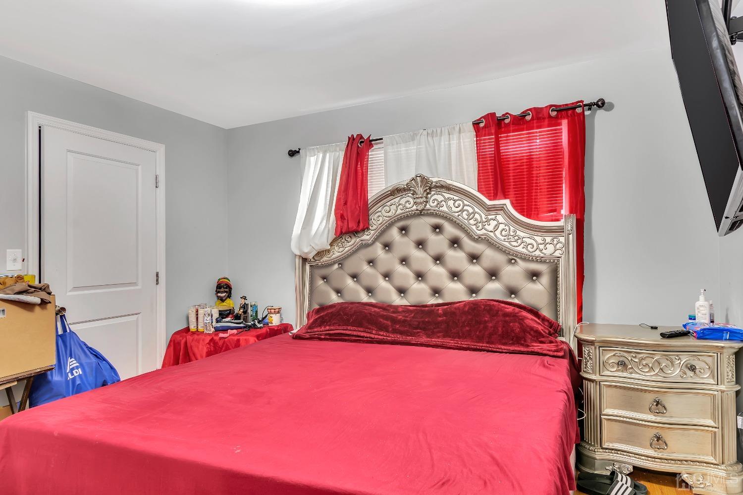 B Wright Place New Brunswick, NJ 08901 - Photo 18 of 34 a bedroom with a bed and a closet with the shoe rack