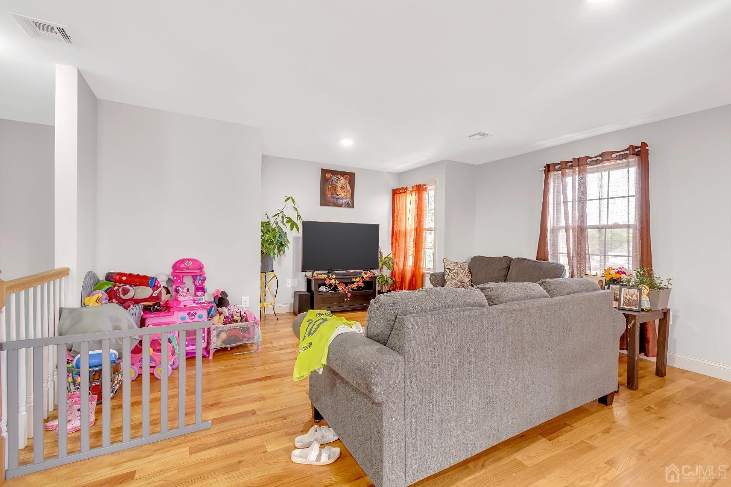 B Wright Place New Brunswick, NJ 08901 - Photo 23 of 34 a living room with furniture and a flat screen tv