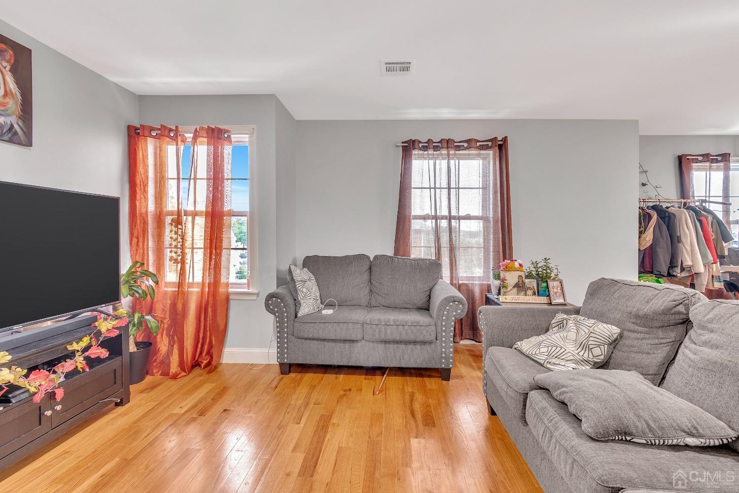 B Wright Place New Brunswick, NJ 08901 - Photo 25 of 34 a living room with furniture and a flat screen tv