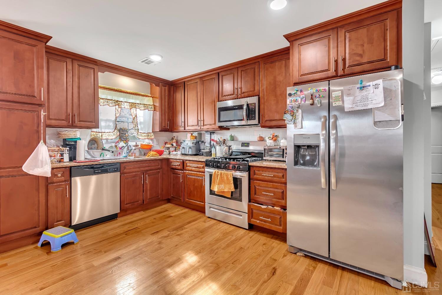 B Wright Place New Brunswick, NJ 08901 - Photo 26 of 34 a kitchen with granite countertop a refrigerator stove top oven a sink and dishwasher