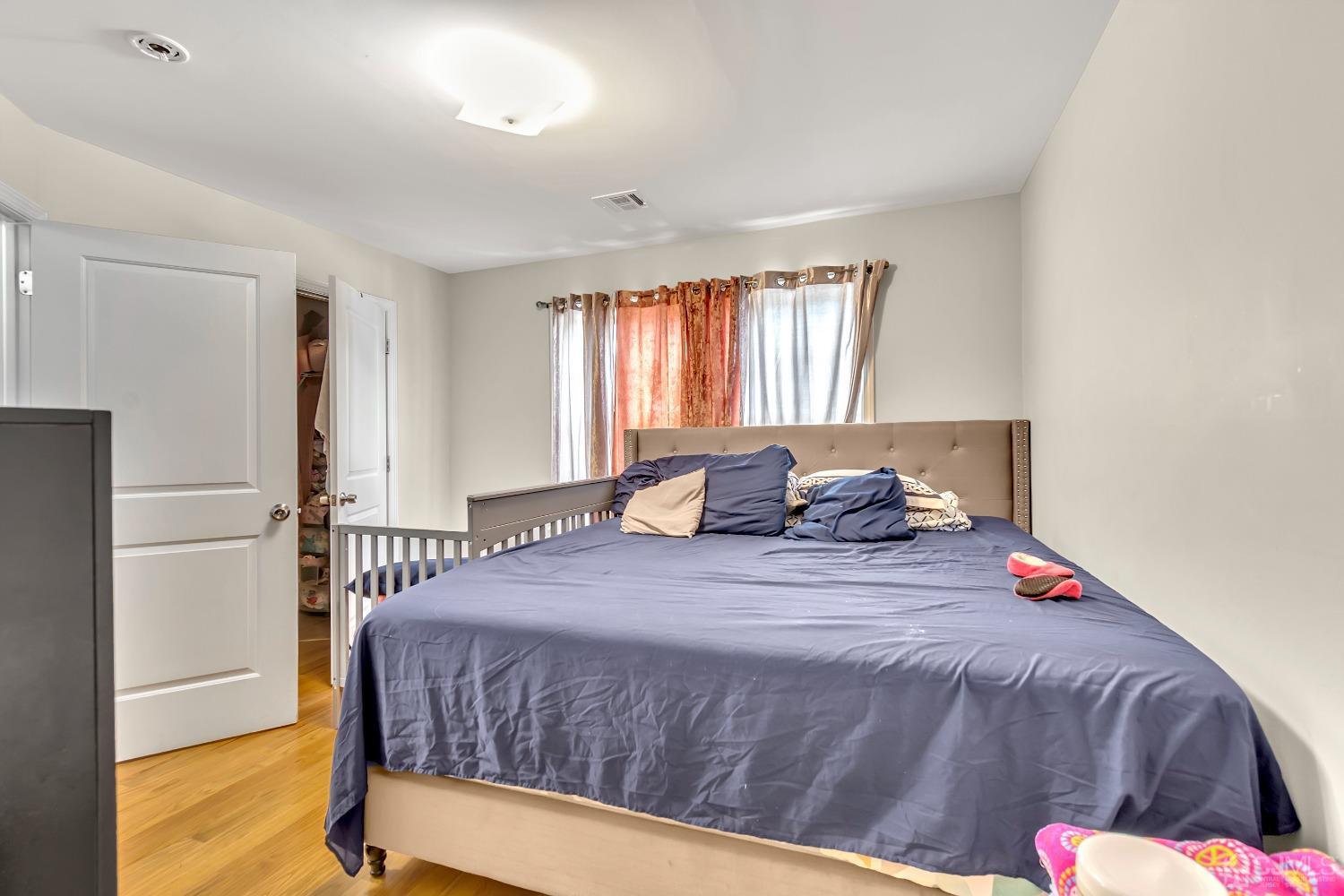 B Wright Place New Brunswick, NJ 08901 - Photo 33 of 34 a bedroom with a bed and a dresser