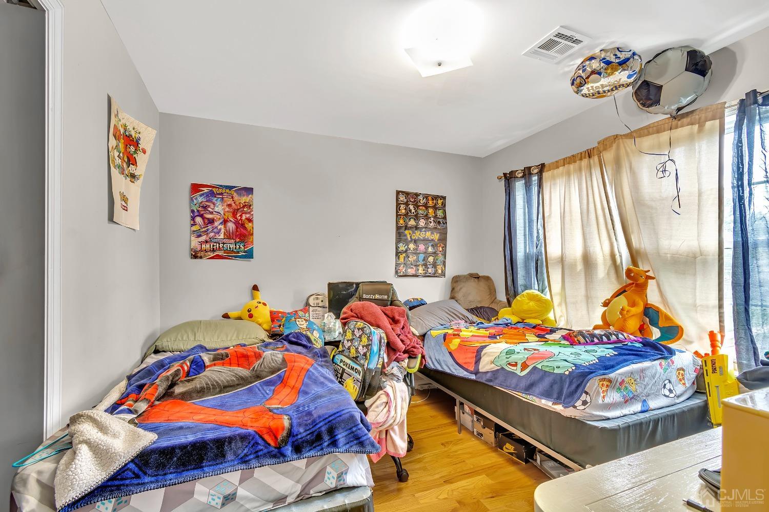 B Wright Place New Brunswick, NJ 08901 - Photo 34 of 34 a bedroom with a bed and window