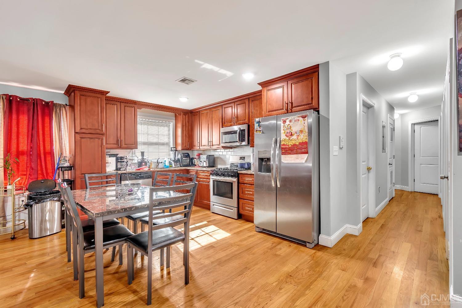 B Wright Place New Brunswick, NJ 08901 - Photo 10 of 34 a kitchen with stainless steel appliances granite countertop a refrigerator and a stove top oven
