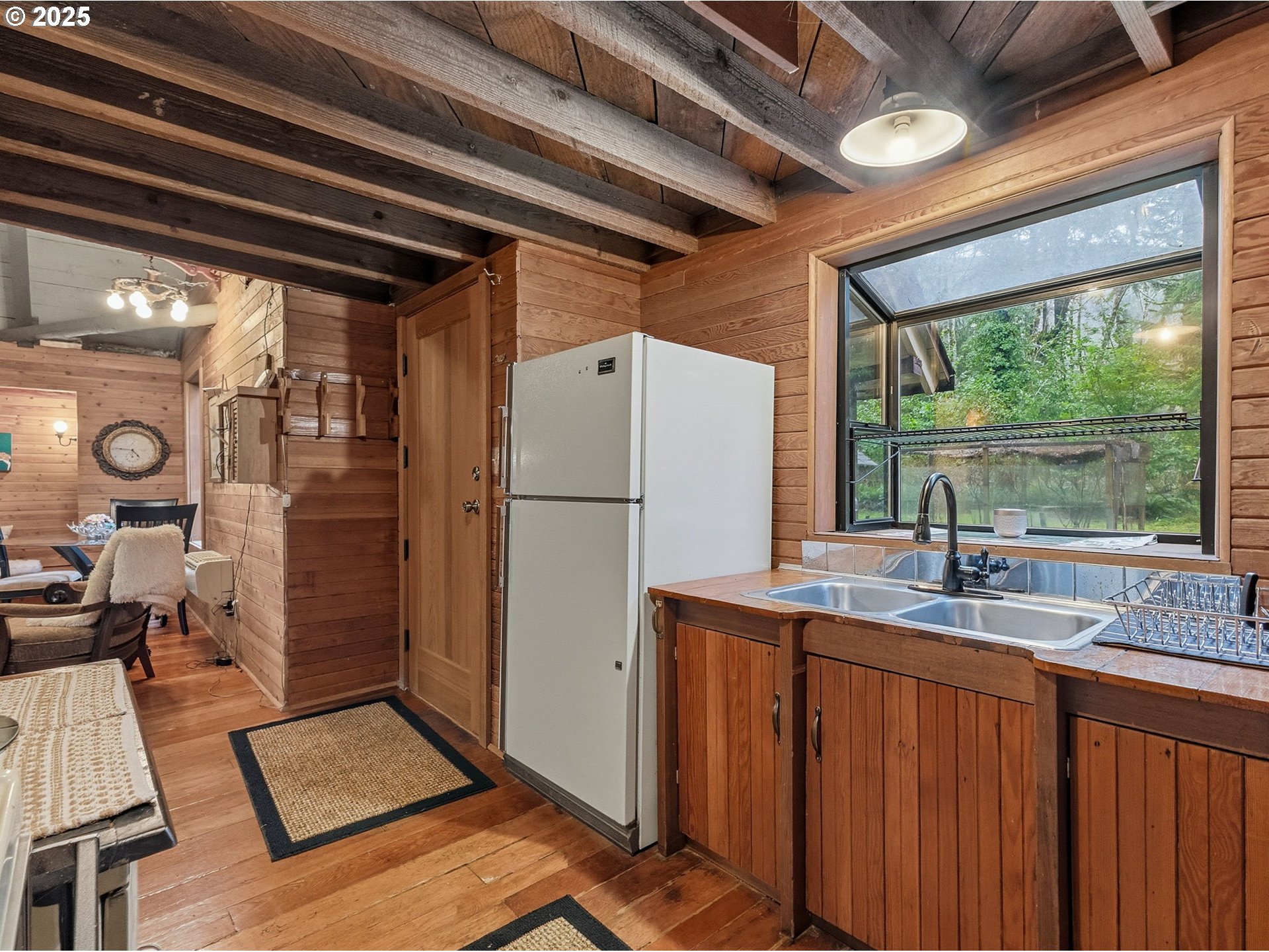 78506 Highway 53 Nehalem, OR 97131 - Photo 20 of 48 a kitchen with refrigerator a sink and cabinets