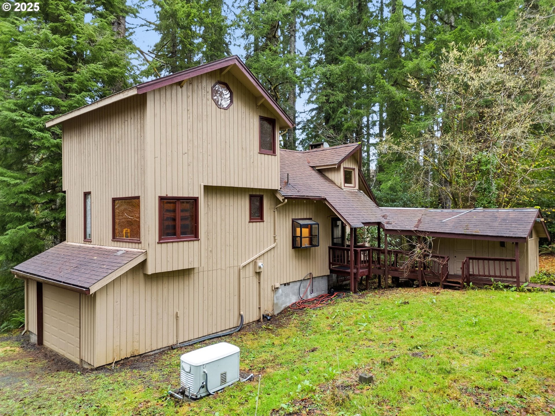 78506 Highway 53 Nehalem, OR 97131 - Photo 2 of 48 a front view of a house with a yard