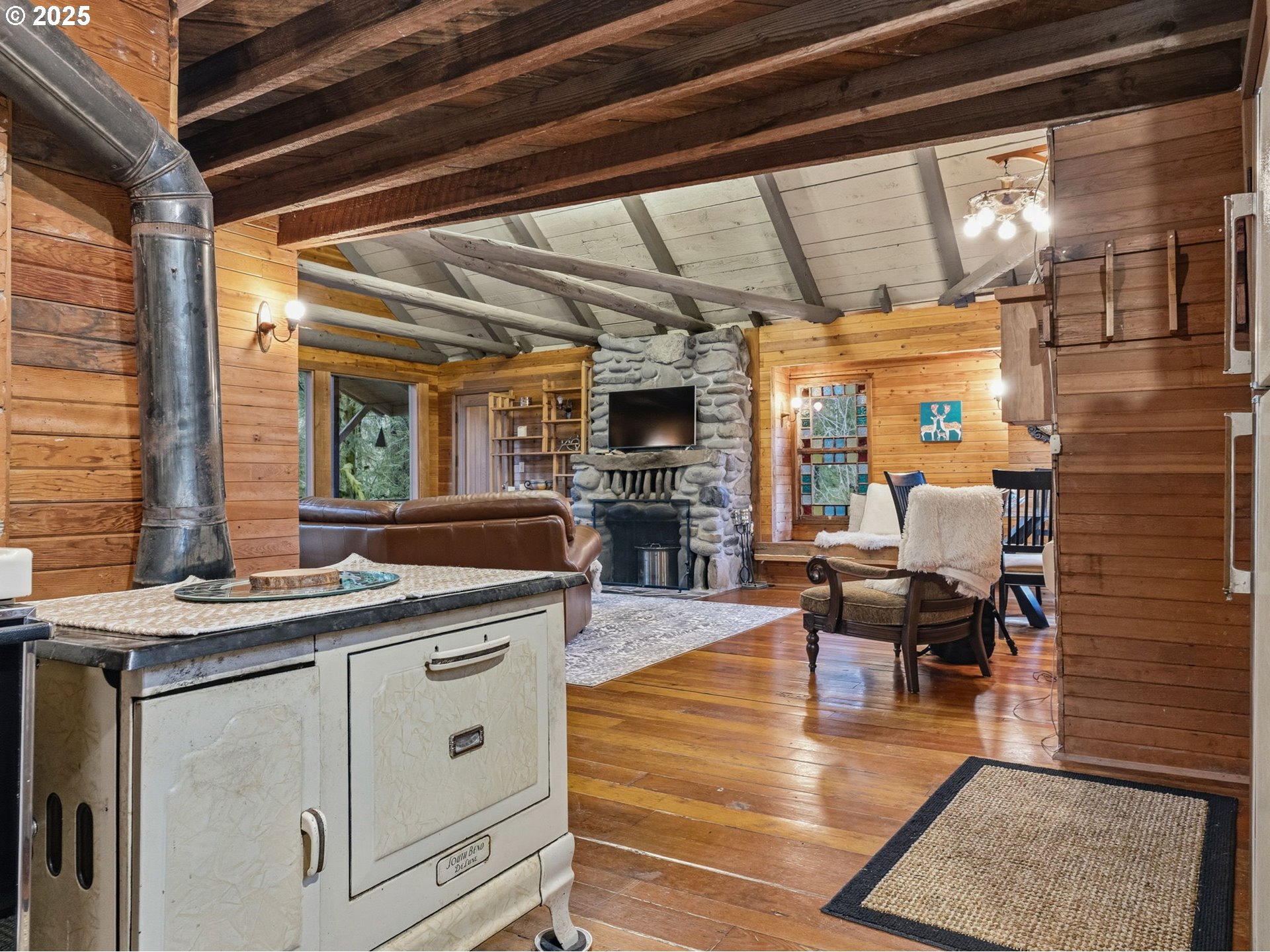 78506 Highway 53 Nehalem, OR 97131 - Photo 21 of 48 a view of a kitchen with furniture and a fireplace