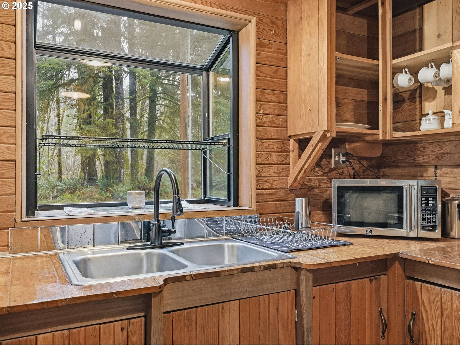 78506 Highway 53 Nehalem, OR 97131 - Photo 22 of 48 a kitchen with a sink and a window