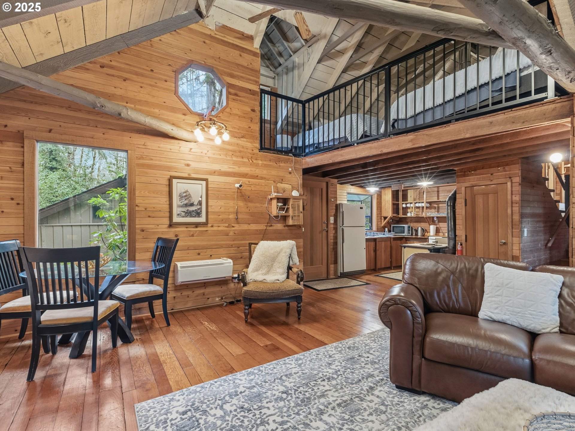 78506 Highway 53 Nehalem, OR 97131 - Photo 26 of 48 a living room with furniture a rug and a window