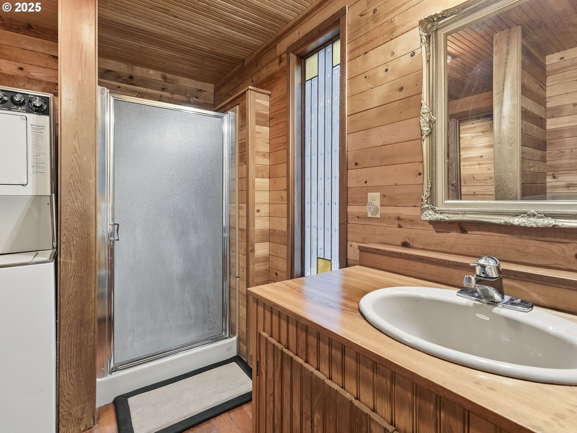 78506 Highway 53 Nehalem, OR 97131 - Photo 33 of 48 a bathroom with a sink and a mirror