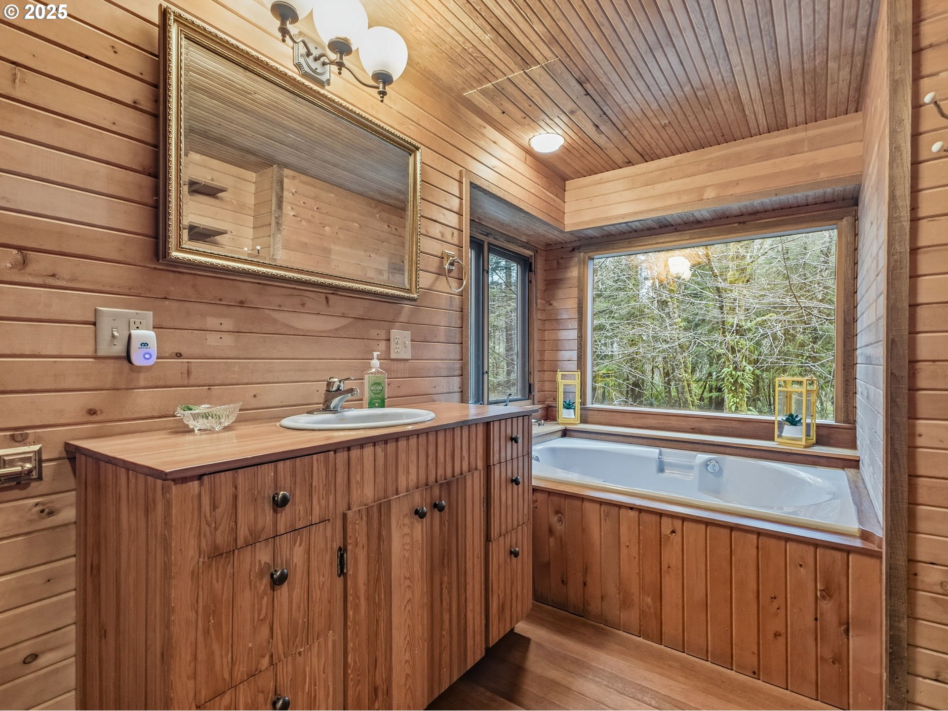 78506 Highway 53 Nehalem, OR 97131 - Photo 34 of 48 a bathroom with a sink and a large mirror