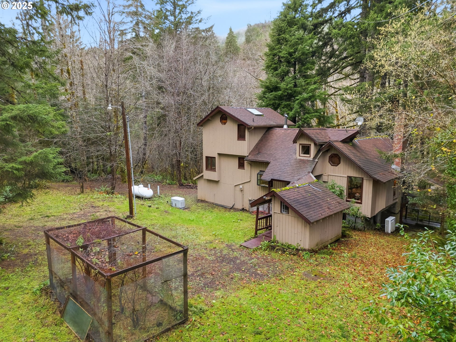 78506 Highway 53 Nehalem, OR 97131 - Photo 4 of 48 a view of a house with backyard and a tree