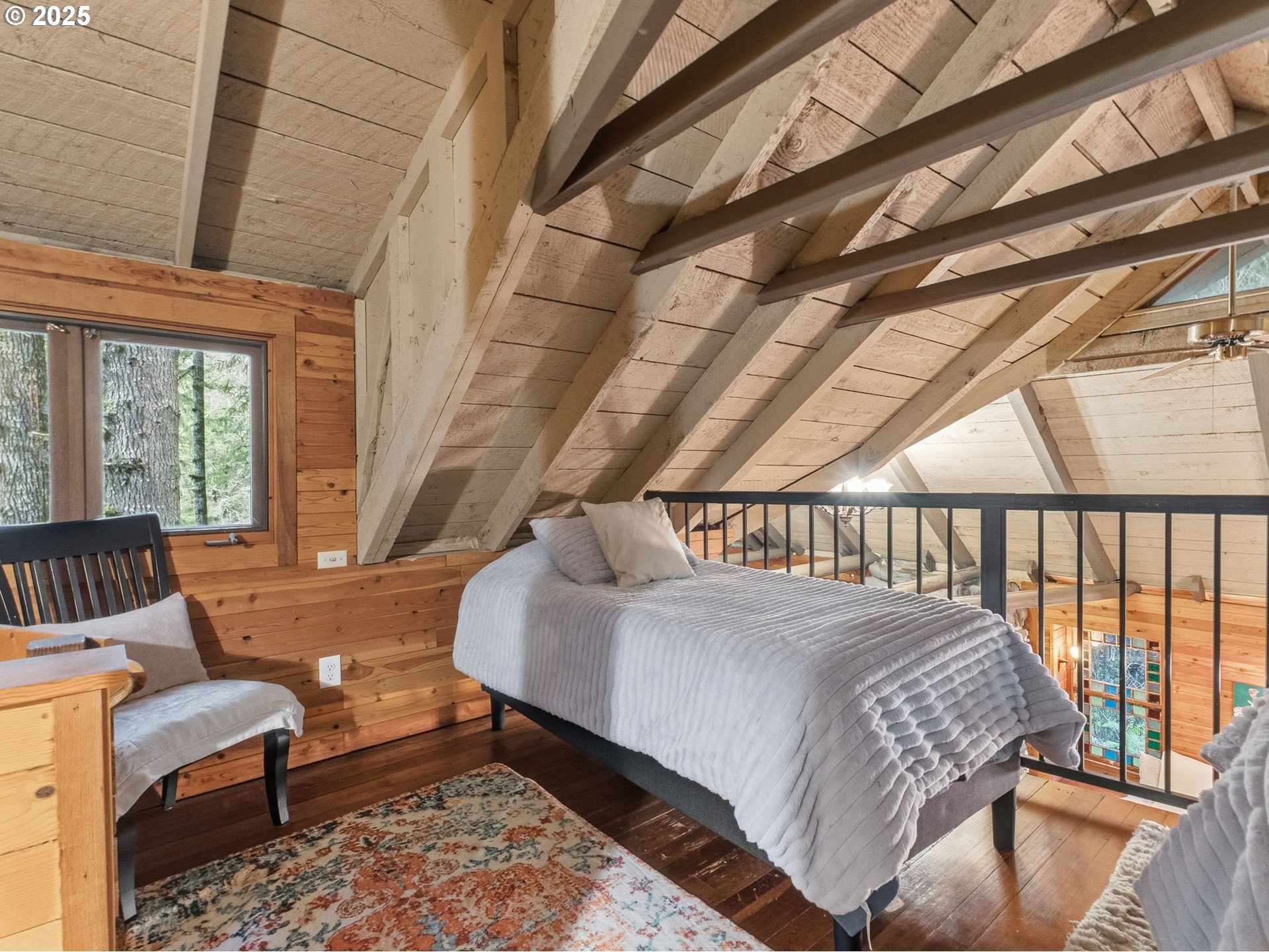 78506 Highway 53 Nehalem, OR 97131 - Photo 43 of 48 a bedroom with a bed a couch and a window