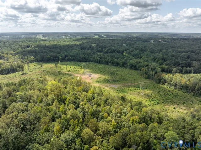 a view of a field with an ocean view