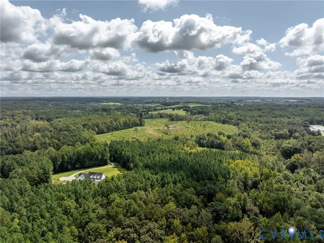 a view of a field with an ocean