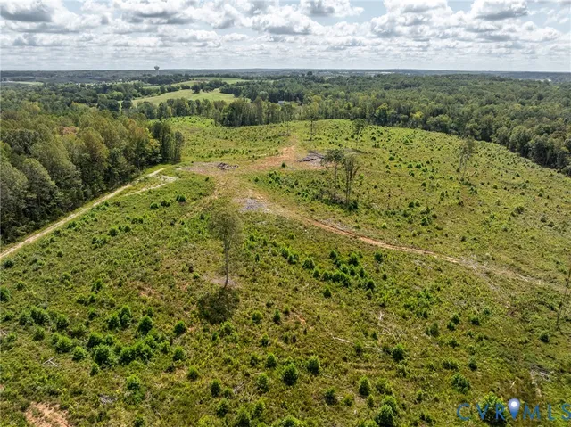 a view of a field with an trees